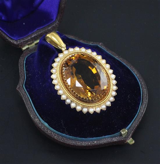 A Victorian gold, citrine and split pearl set oval pendant, 1.5in.